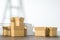 Pile of cardboard boxes on white background with Ladder shadow