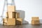 Pile of cardboard boxes on white background with Ladder shadow