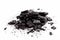 Pile of charcoal, burnt pieces of coal, with space for text on white background