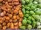 Pile of chayote and potatoes for sale at groceries store