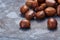 Pile of chestnuts on stone texture floor