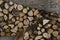 Pile of chopped firewood stored in a stone shed