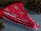 Pile of Christmas and winter themed bunting on grey wood background