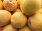 pile of citrus fruits on supermarket shelf