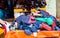 Pile clothes on the local market, Puttaparthi, India. With selective focus