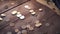 Pile of coins falling on the wooden table