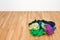 Pile of colorful clothes on the wooden floor