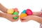 Pile of colorful easter eggs in two child hands