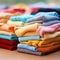 A pile of colorful knitted clothing on a wooden table, AI