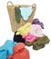 Pile of colorful shirts in a wicker basket