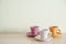 Pile of colorful vintage cups of coffee on wooden table
