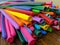 A pile of colourful long modelling balloons