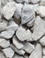 Pile of construction gravel stone lie in group, gray rock gravel show close up texture and dust, object design. White background