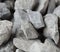 Pile of construction gravel stone lie in group, gray rock gravel show close up texture and dust, object design. White background