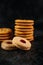 A pile of cookies on a wooden table