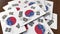 Pile of credit cards with flag of South Korea. Korean banking system conceptual 3D animation