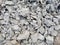Pile of crushed concrete with elements of crushed stone. Image for the background
