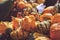 Pile of decorative mini pumpkins and gourds, on locale farmers market; autumn background