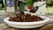 Pile of deep fried grasshoppers in a plastic plate