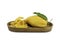 Pile of dehydrated mango and ripe mango with leaf in a wooden tray on white background