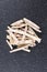 Pile of dehydrated taro snack sticks isolated over black top down view