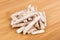 Pile of dehydrated taro snack sticks isolated over wood