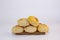 Pile of delicious Paraguayan chipa bread on a wooden tray with an isolated background