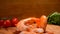 A pile of delicious peeled shrimps is falling on the wooden board