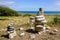 Pile of different pebbles zen balanced stones stack on sea coast beach