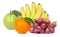 Pile of different types of fresh organic fruits  yellow ripe banana, red grape,  orange fruit and guava with green leaf  isolate