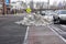 A pile of dirty snow in a mostly clear parking lot