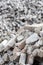 Pile of disassembled gray pavement bricks with selective focus