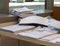 Pile of document on desk at office