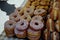 Pile of doughnuts covered in sprinkles on a market stall