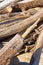 Pile of driftwood piled by the waves of the sea - driftwood background