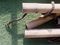 Pile of dry brown bamboo sticks with wooden texture over green astroturf on background