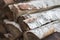 Pile of firewood. Birch bark and wood logs. Stack of birch logs. Chopped tree trunk. Hardwood close up. Ecology energy.