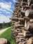 Pile of firewood with forest and sky background . Fie allo sciliar, South Tyrol, Italy