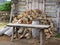 Pile of firewood next to hut cabin in mountain alps . Alpe di Siusi, South Tyrol - Italy