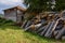 Pile of firewood next to a shack