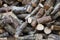 Pile of firewood and wood logs. Stock of fire wood for winter. Natural wooden background