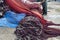 Pile of fishing nets with buoys on a dock and fishermen