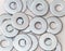 Pile of flat metal washers for screws and fasteners