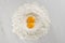 Pile of flour with egg yolks