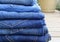Pile of Folded Blue Denim Jeans Closeup in a Variety of Shades