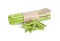 Pile of fresh asparagus and bundle of stem on white background