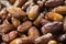 Pile of fresh dried date fruits on a traditional craftsman market. Fruit background. selective focus