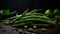 A pile of fresh green beans on a wooden table