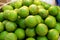 Pile of Fresh green lemon lime for sale in the market