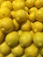 Pile of fresh lemons in a grocery store